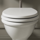 Product Lifestyle Image of Burlington Guild Varley White Soft Close Toilet Seat in beige bathroom - front Angle - GU6105VW